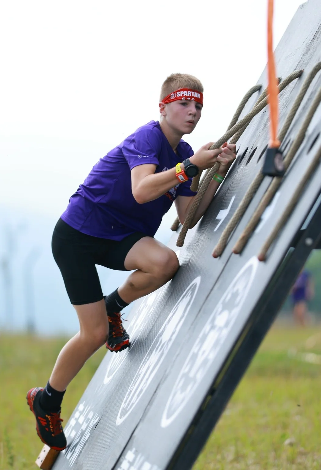 Harry climbing an obstacle wall